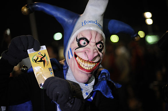 spain v hondura: Honduran fan in a scary mask shows of his ticket