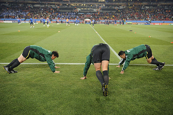 Spain v Honduras: The referee and his assistants warm up