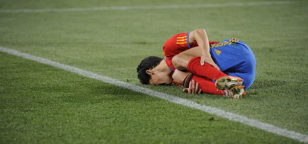 Spain v Honduras: Jesus Navas lies in pain after being fouled by Emilio Izaguirre