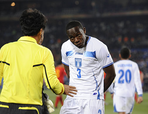 Spain versus : Maynor Figueroa queries why the referee's assistant gave the penalty