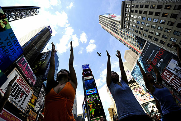 24 hours in pictures: New York, US: Participants take part in a mass yoga session in Times Square