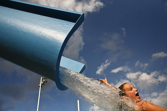 24 hours in pictures: Houston, US: Gracie Duson screams as she slides down the water drop-slide