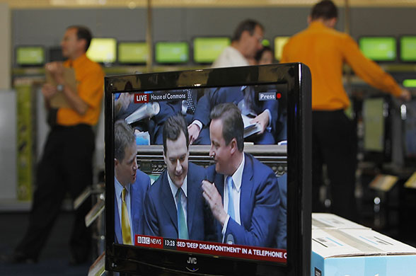 budget day: Osborne and cameron on TV in Edinburgh 