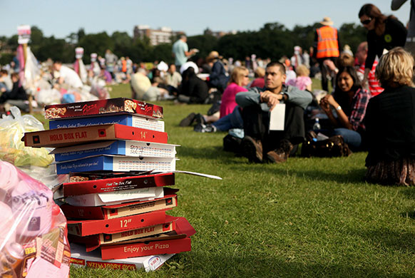 wimbledon atmosphere: Empty pizza boxes are stacked up as people queue for tickets