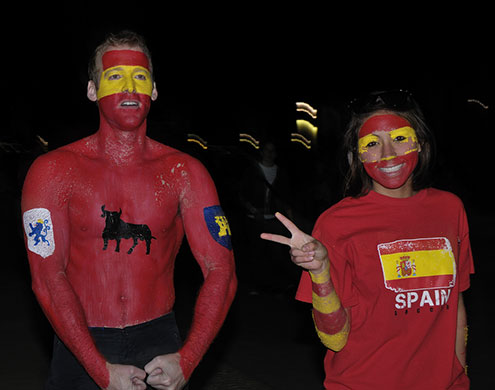 A fan who has painted his chest in Spain's national colours