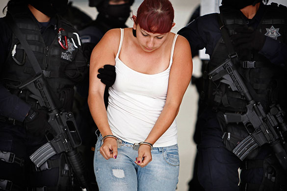 24 hours in pictures: Federal police escort suspect Jessica Garcia Jaime Mexico