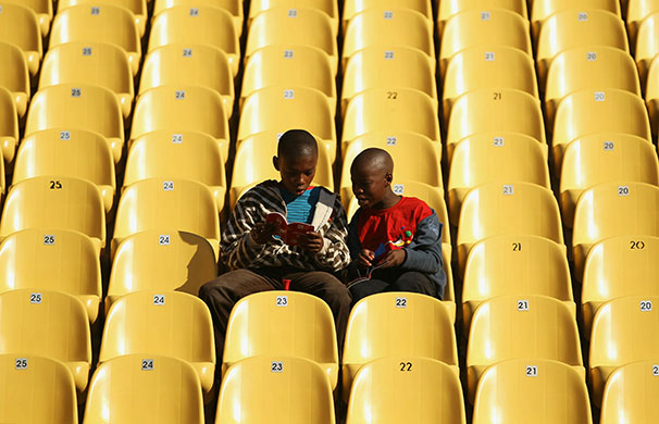 24 hours in pictures: Rustenburg, South Africa: Young world cup football fans
