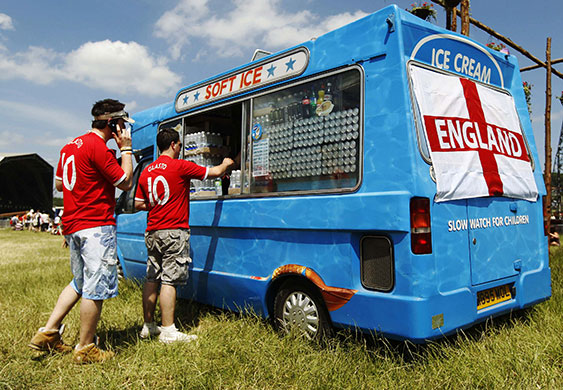 Glastonbury fans: England fans buy drinks at an ice cream van at the Glastonbury Festival