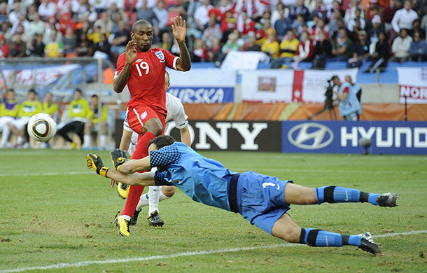 Slovenia v England: Samir Handanovic punches the ball clear as Defoe waits ready to pounce