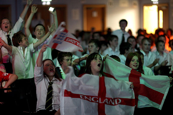 England fans: Wakefield, UK: Students celebrate the first goal at Horbury School