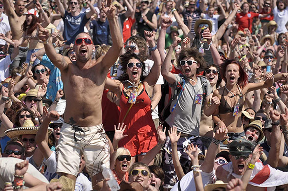 England fans: Somerset, UK: The crowd at Glastonbury Festival go wild as England score