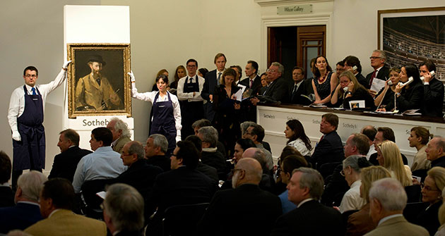 Sotheby's and Christie's: Sotheby's staff hold the Edouard Manet painting 