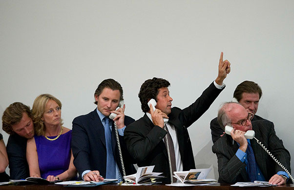 Sotheby's and Christie's: A telephone bidder places a bid during the Sotheby's 