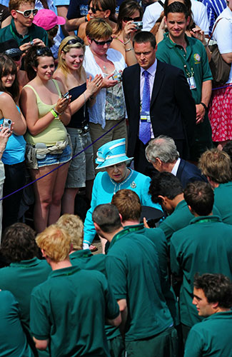 The Queen at Wimbledon: Queen Elizabeth II is shown around by Tim Phillips