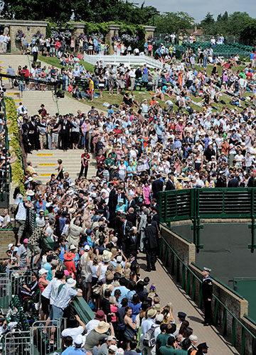 The Queen at Wimbledon: Queen Elizabeth II walks through the Wimbledon grounds