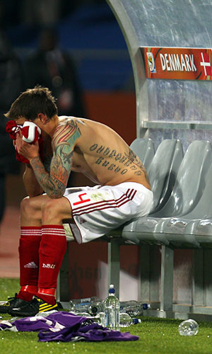 World Cup Day 14: Denmark's Daniel Agger is dejected as Denmark go out of the tournament