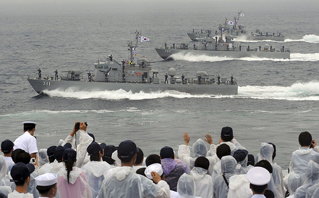 Korean War anniversary: Sailors salute as they sail past on South Korean naval patrol ships