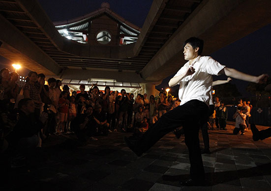 Michael Jackson memorial: A fan of Michael Jackson dances during a memorial for the singer in Taiwan