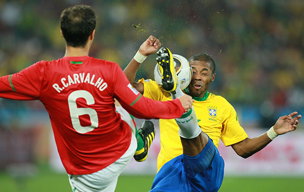 sport: Brazil's defender Juan (R) kicks the bal