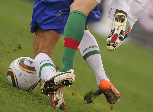 sport: Brazil's defender Daniel Alves (L) is ch