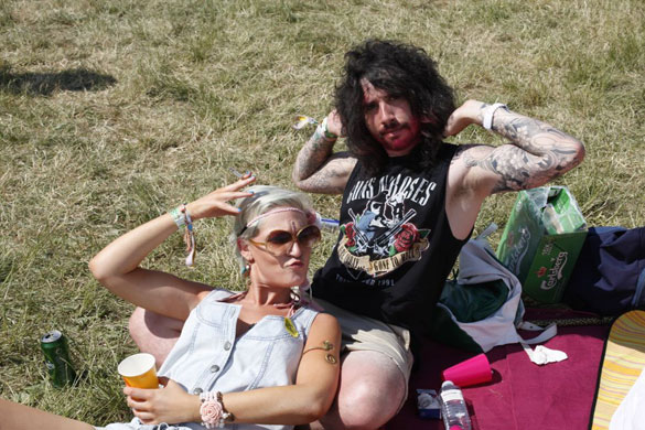 t-shirts: A man wearing a Guns and Roses t-shirt at Glastonbury