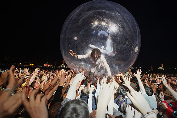 24 Hours: The Flaming Lips Wayne Coyne rolls above the crowd inside a plastic bubble