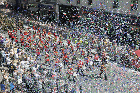 Armed Forces Day: Troops march through the ticker tape during Armed Forces Day in Cardiff