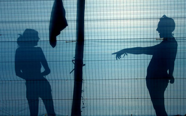 Day Four: Two festival goers share a joke as they have a wash at Glastonbury