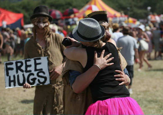 Day Four: Festival-goers receive free hugs at Glastonbury