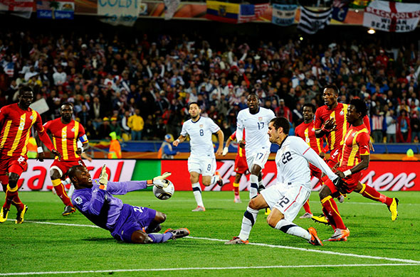 Knockout stages day 1: Ghana goalkeeper Richard Kingston makes a save from Benny Feilhaber