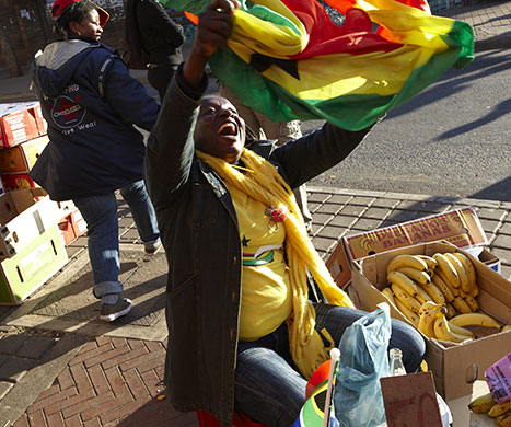 African fans in Jo'burg: A Ghanaian street trader shows off her colours