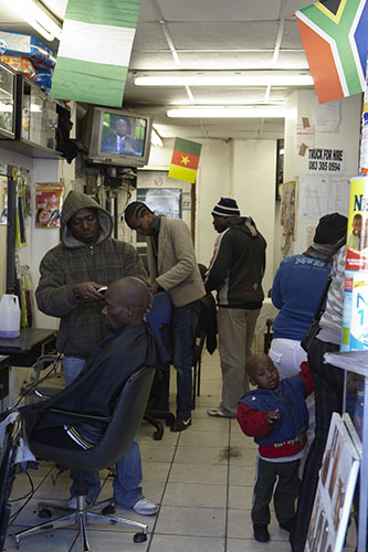 African fans in Jo'burg: The competing African nations flags are on display in this barber shop 