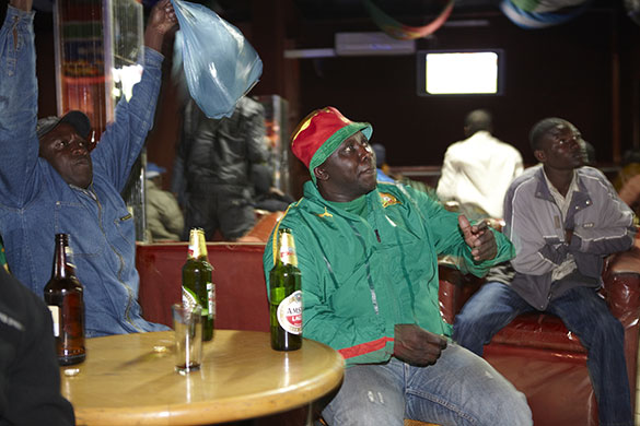 African fans in Jo'burg: Cameroon fans in a bar while they watch their team take on Japan