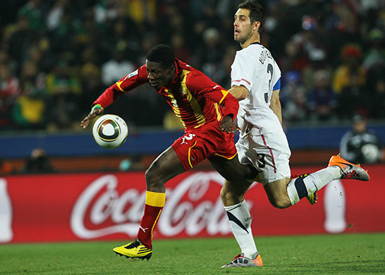 Knockout stages day 1: Asamoah Gyan chases the ball