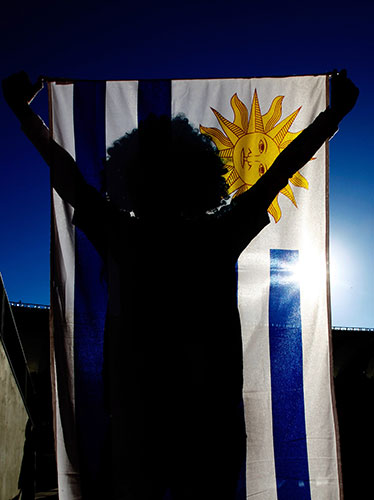 Knockout stages day 1: Uruguay fan with flag