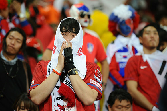 Knockout stages day 1: A South Korea fan cries after losing 