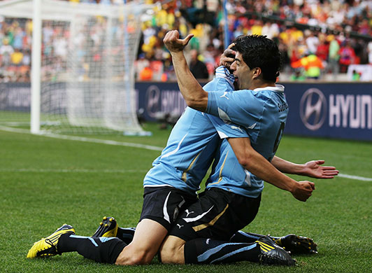 Knockout stages day 1: Luis Suarez celebrates scoring his first goal