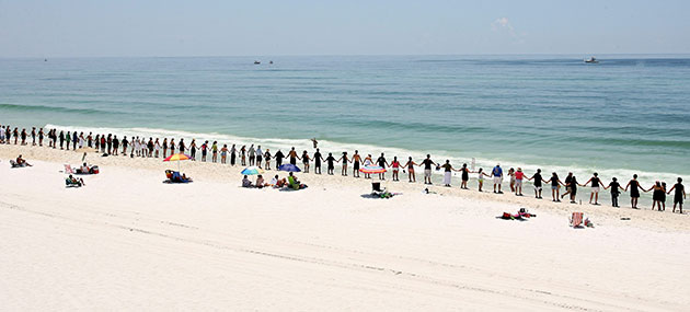 24 hours in pictures: Florida, US: People line up on the beach to protest offshore oil drilling