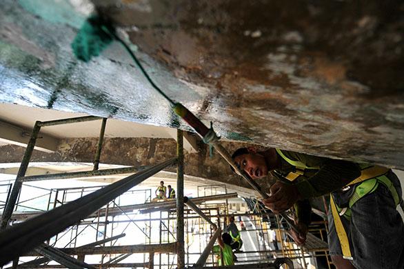 24 hours in pictures: Manila, Philippines: Construction workers at the Quirino grandstand