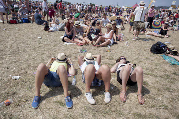 Heat: Revellers sunbathe by the Other stage on day five