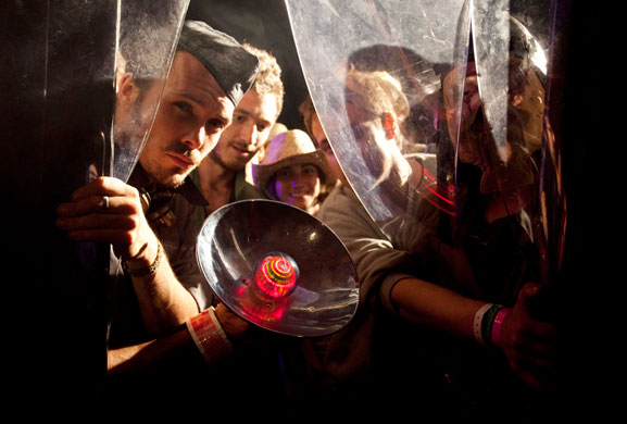 Glastonbury by night: Punters queue up hoping to be transported to another world