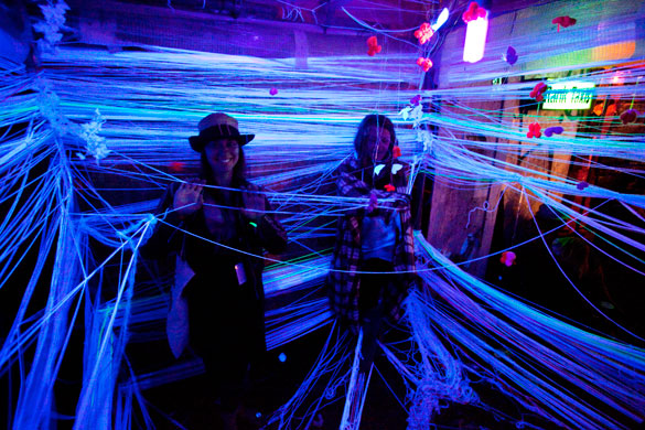 Glastonbury by night: UV strings get festival goers all tangled up