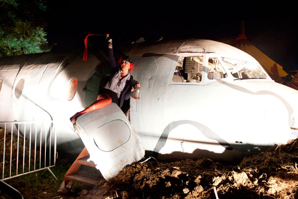 Glastonbury by night: A air hostess sends distress signals after her plane crashes in Shangri-La