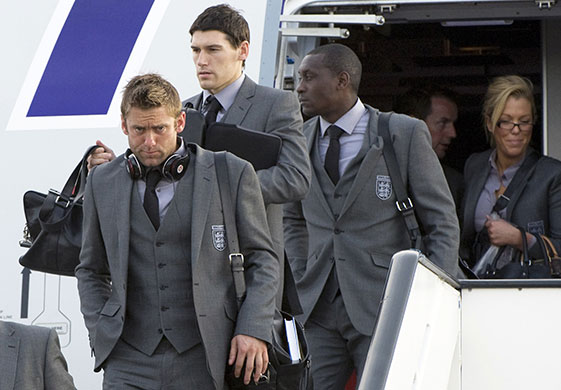 England arrive home: Robert Green, Gareth Barry and Emile Heskey