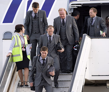 England arrive home: Captain Steven Gerrard and Wayne Rooney 