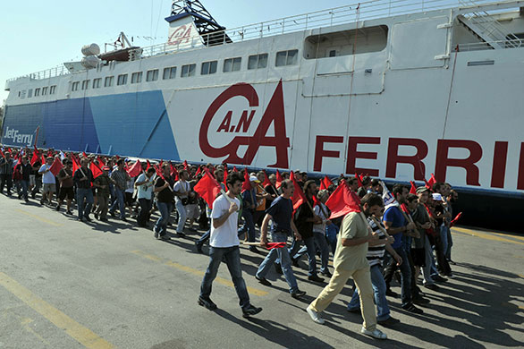 Greece protests: Communist-affiliated strikers march through the port of Piraeus
