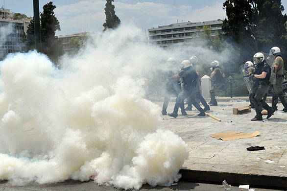 Greece protests: Protesters clash with riot police in front of the parliament in Athens