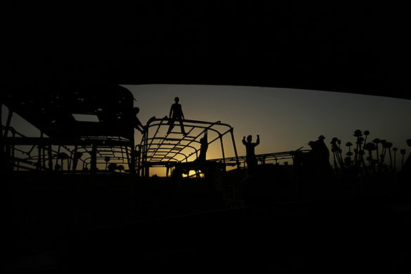 24 hours: Children play at a dump filled with buses in Kabul, Afghanistan
