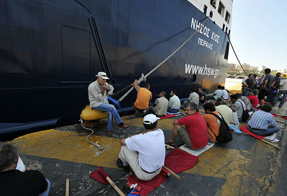 Greece protests: Communist-affiliated strikers sit by the Island Chios ferry