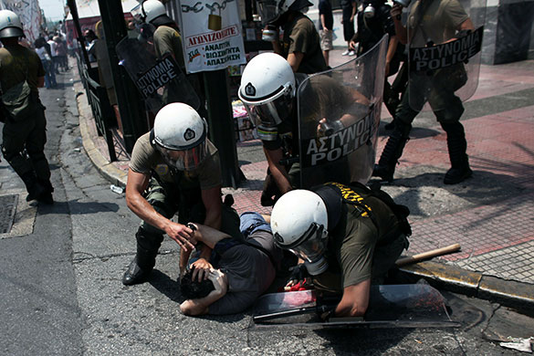 Greek protests: A demonstrator is arrested by Greek police